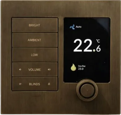A bronze faceplate with engraved Bright, Ambient, Low, Volume and Blinds buttons beside a thermostat screen reading 22.6 degrees