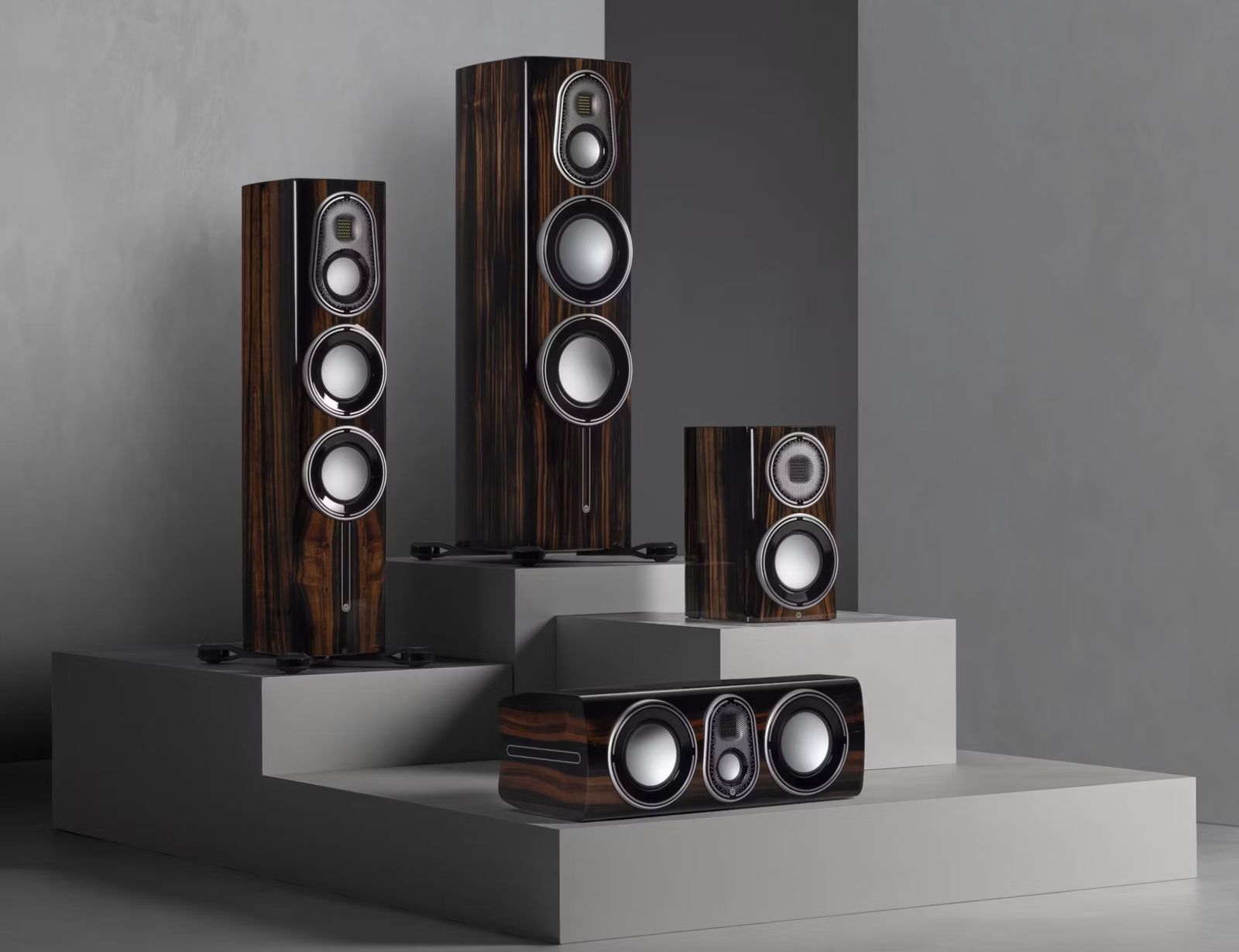 A pair of floorstanding loudspeakers in a wood finish
