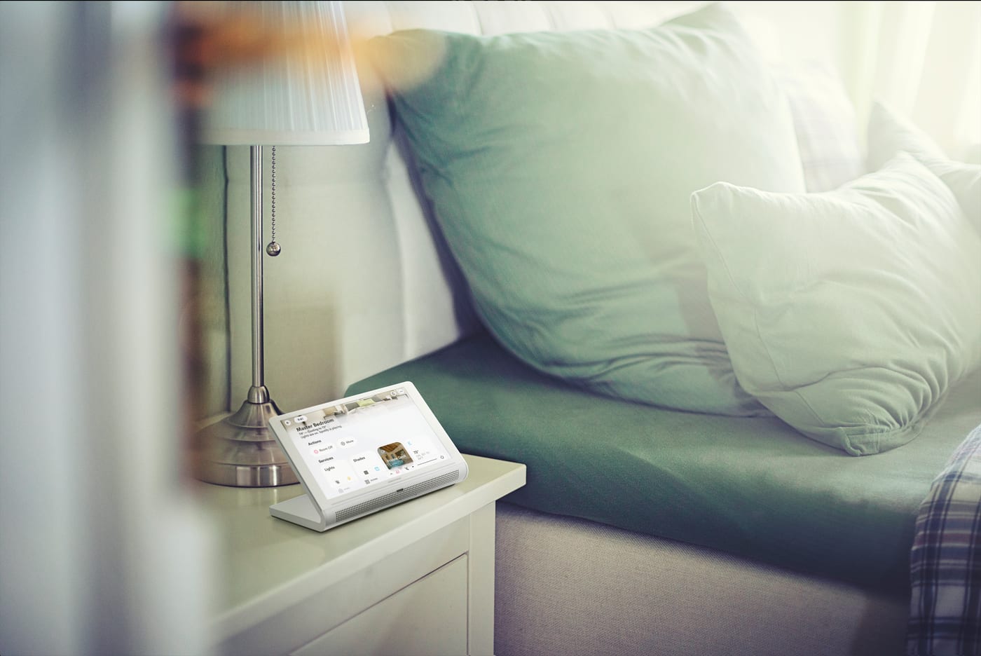 A bedside touchscreen controlling bedroom lighting and climate